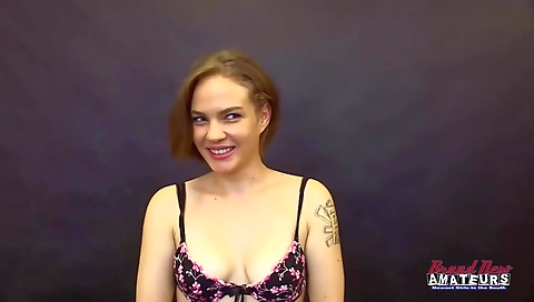 Blonde teen with a tattoo on her face sucks a black dick