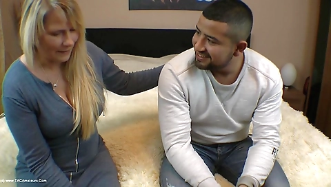 Blonde milf fucked by her stepdaughter in the kitchen